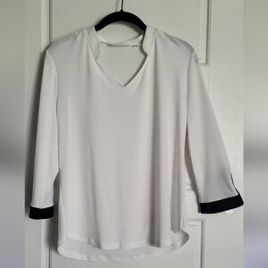 Chic White Blouse with Black Trim